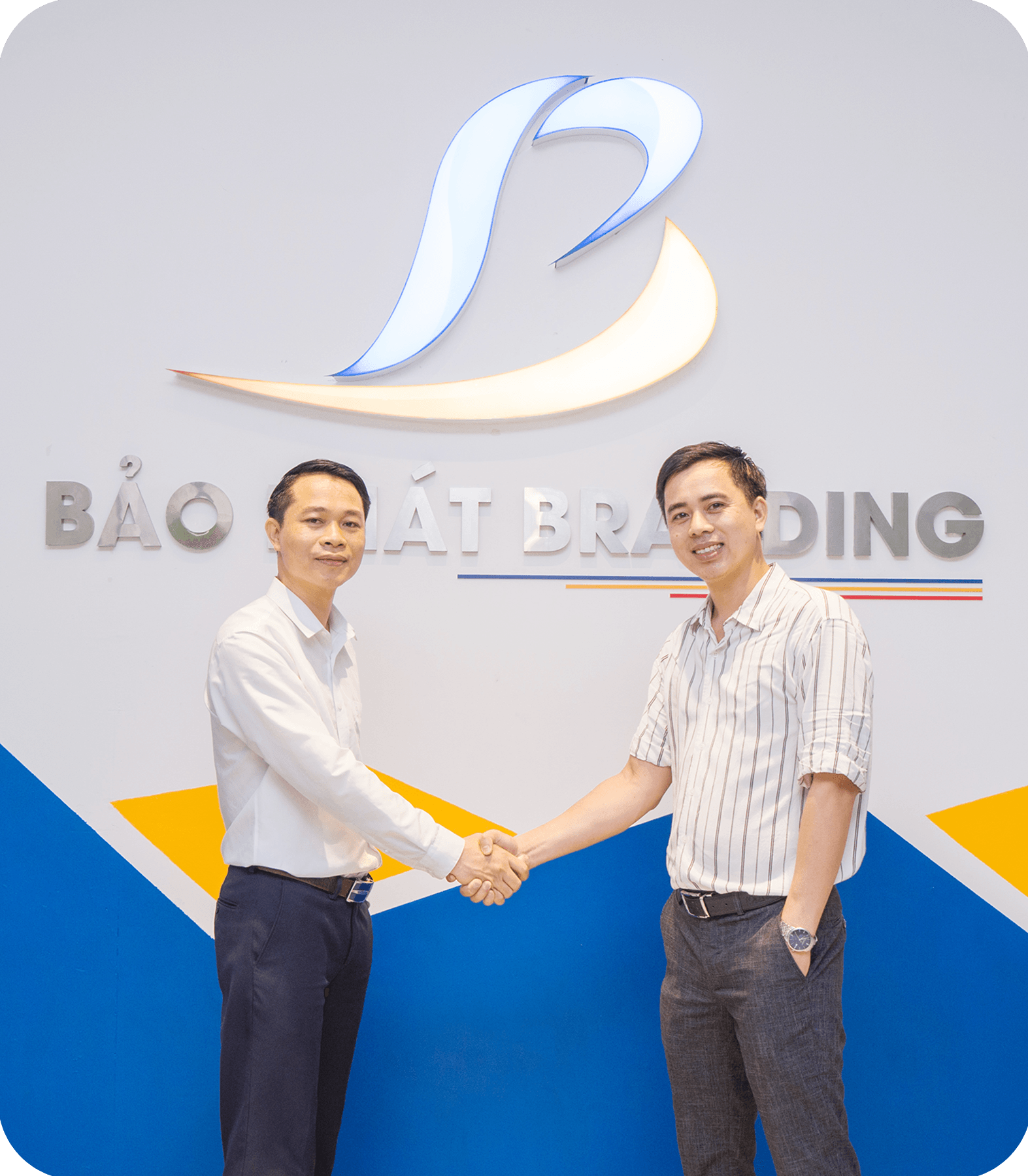Two business professionals looking at tablets and smiling